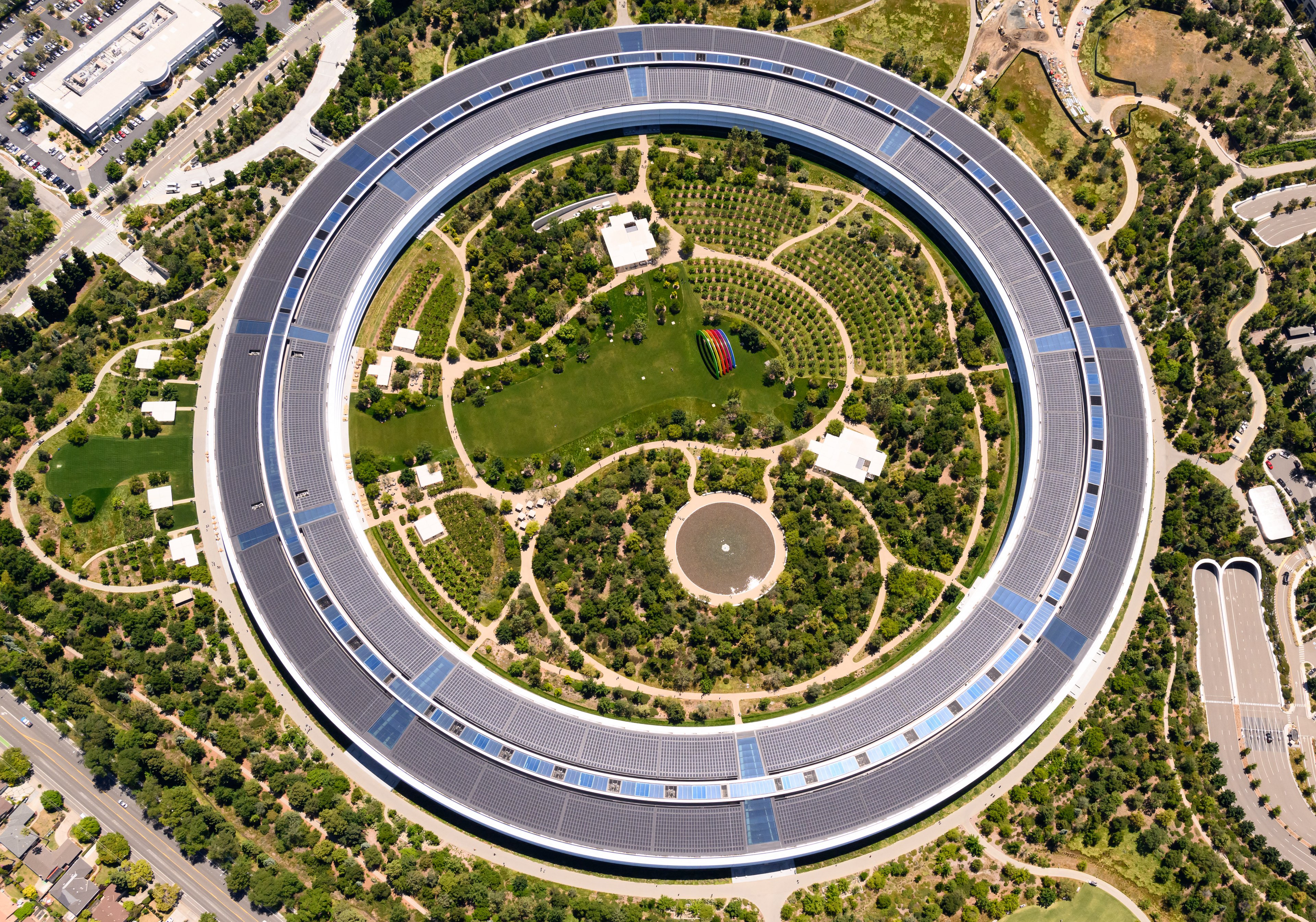 Apple Park headquarters in Cupertino, California. The company's legal offensive against OpenAI could reshape the AI hardware landscape. (Photo by JOSH EDELSON/AFP via Getty Images)