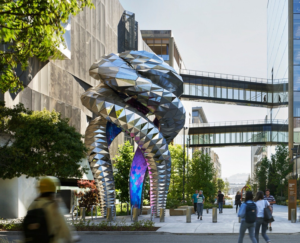 OpenAI headquarters in San Francisco, where Alfozan allegedly installed a recording device in an executive conference room. The metallic helix sculpture in the plaza has become a local landmark.
